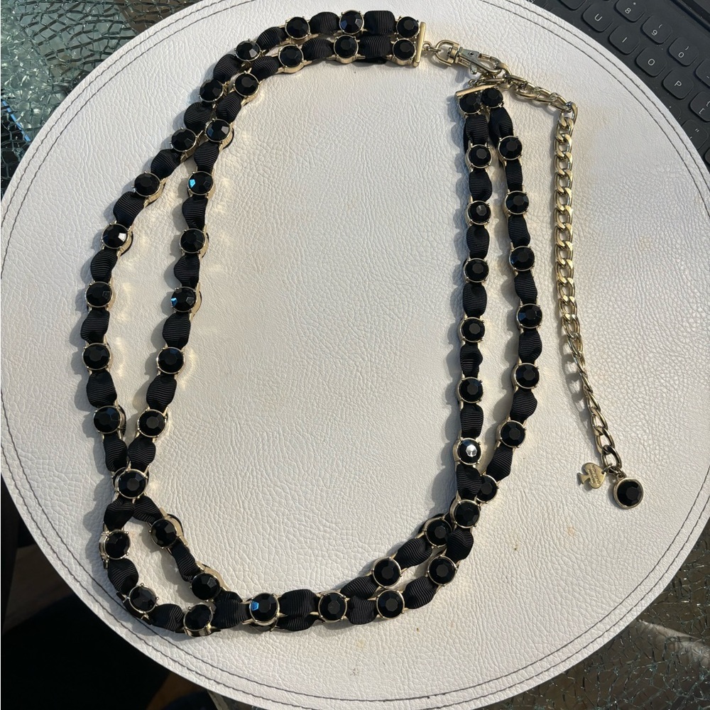 Kate Spade, 30” necklace. Gold with black stones and woven ribbon.